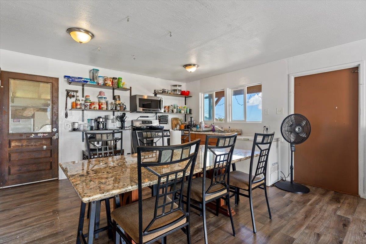 248 Piliwale Road Kula, HI 96790 - Photo 18 of 22 a dining room with furniture and wooden floor
