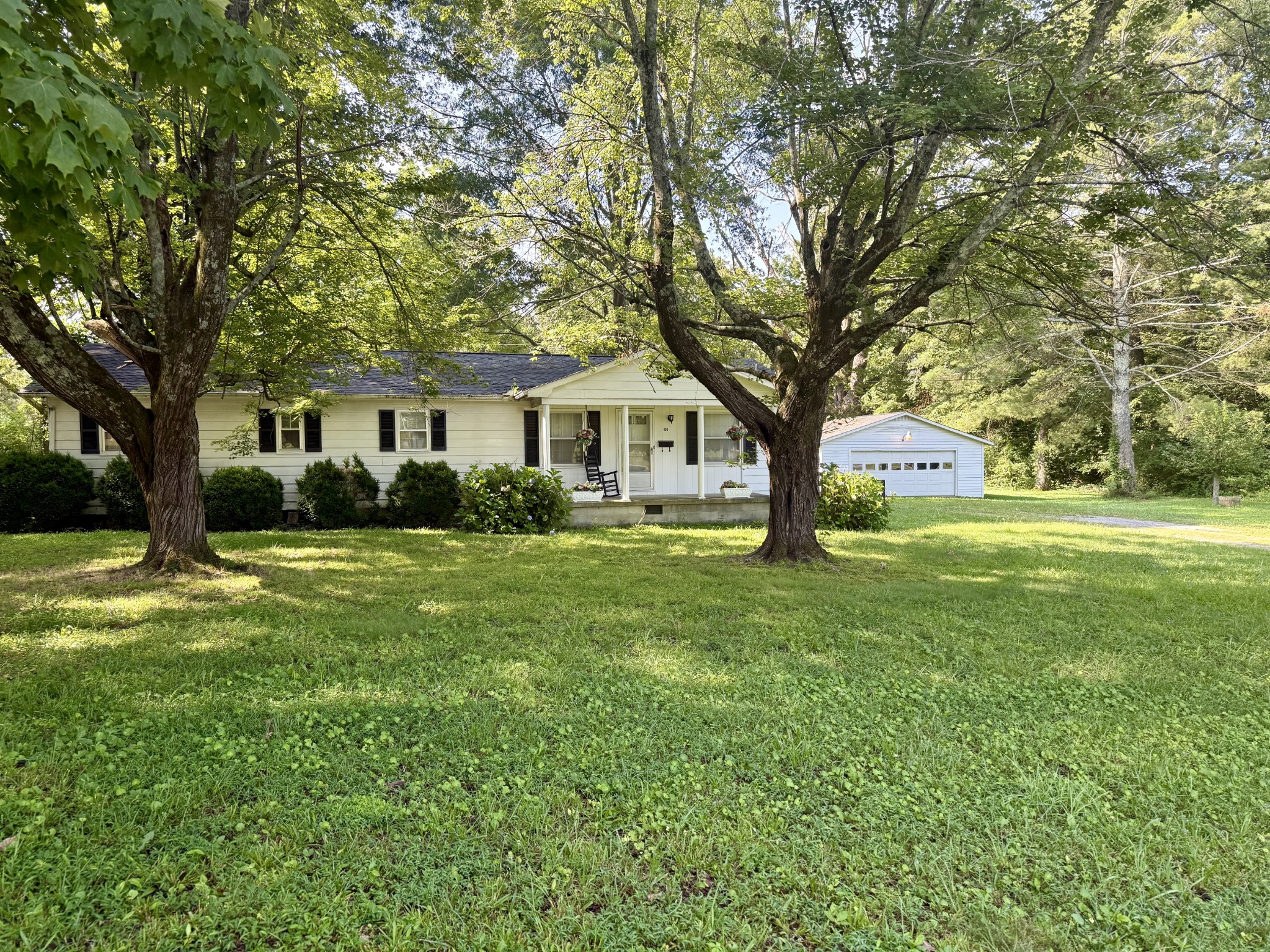498 Ralph Broadrick Road Normandy, TN 37360 - Photo 16 of 17 a front view of a house with garden and trees
