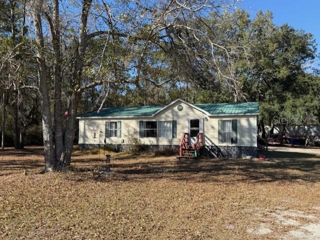 a front view of a house with sitting area