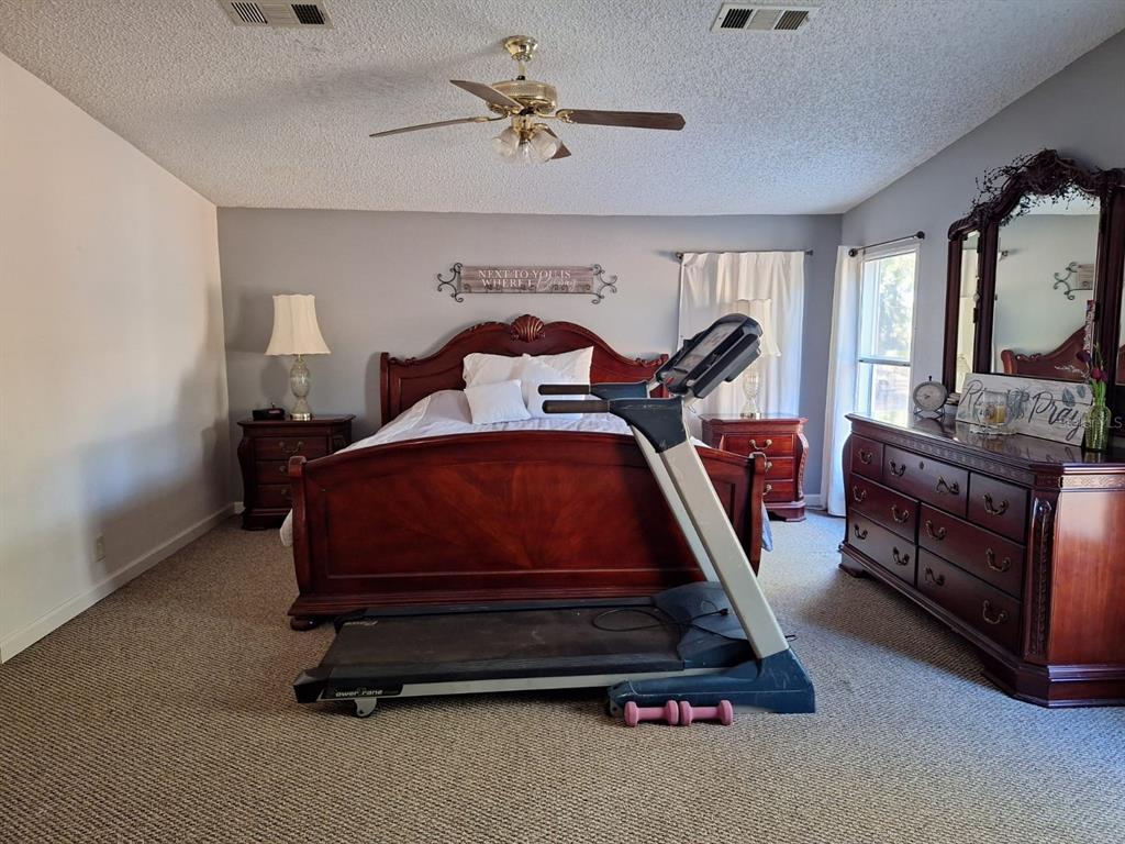 14899 Southwest 92nd Way Lake Butler, FL 32054 - Photo 14 of 39 a room with furniture and a mirror