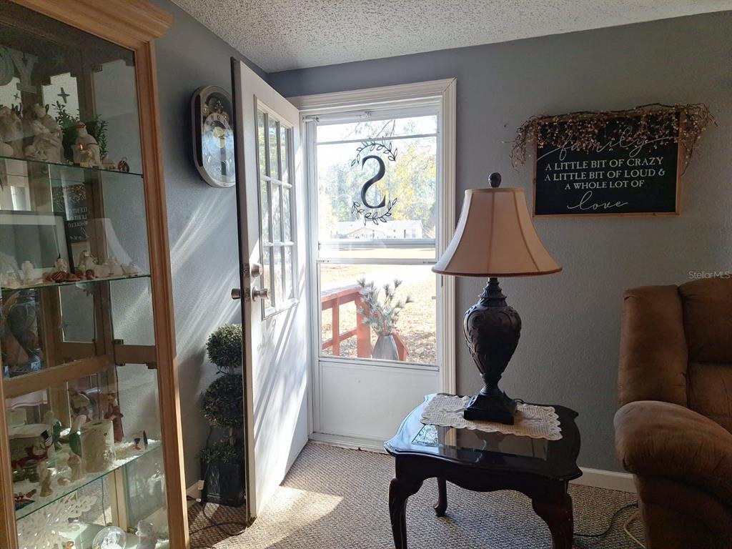 14899 Southwest 92nd Way Lake Butler, FL 32054 - Photo 3 of 39 a living room with furniture and a window
