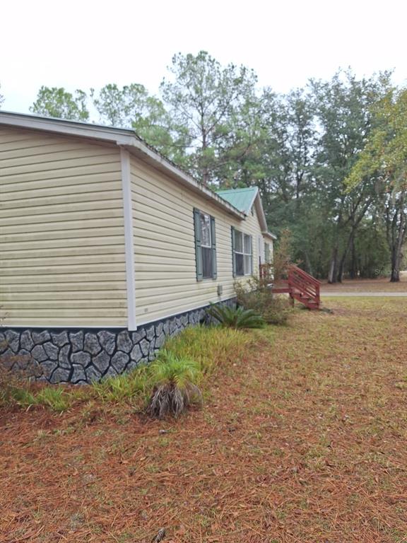 14899 Southwest 92nd Way Lake Butler, FL 32054 - Photo 34 of 39 a view of a house with a yard