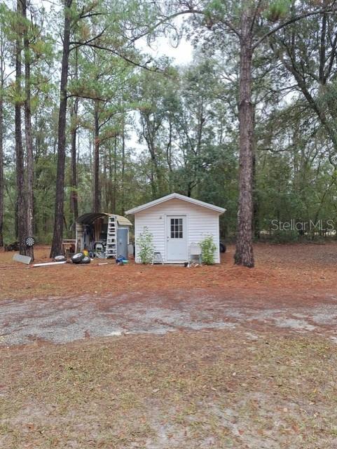 14899 Southwest 92nd Way Lake Butler, FL 32054 - Photo 35 of 39 a house with trees in the background