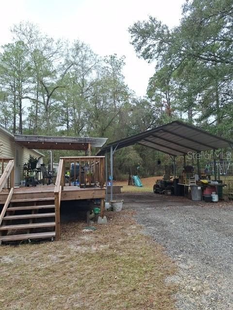 14899 Southwest 92nd Way Lake Butler, FL 32054 - Photo 37 of 39 a view of backyard with outdoor seating and barbeque oven