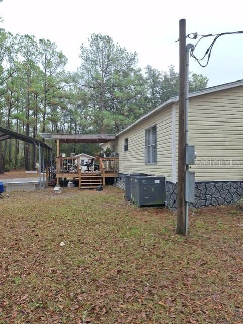 14899 Southwest 92nd Way Lake Butler, FL 32054 - Photo 38 of 39 a view of a house with a yard and sitting area
