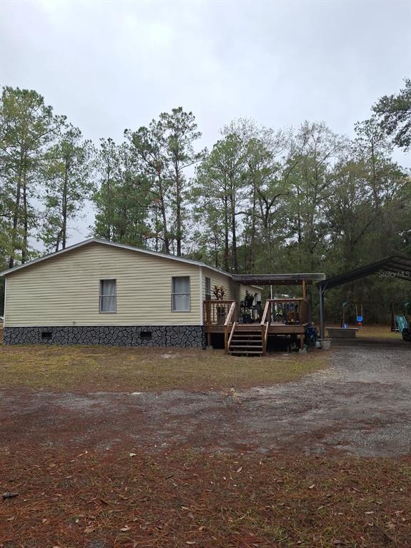 14899 Southwest 92nd Way Lake Butler, FL 32054 - Photo 39 of 39 a view of a outdoor space with car parked