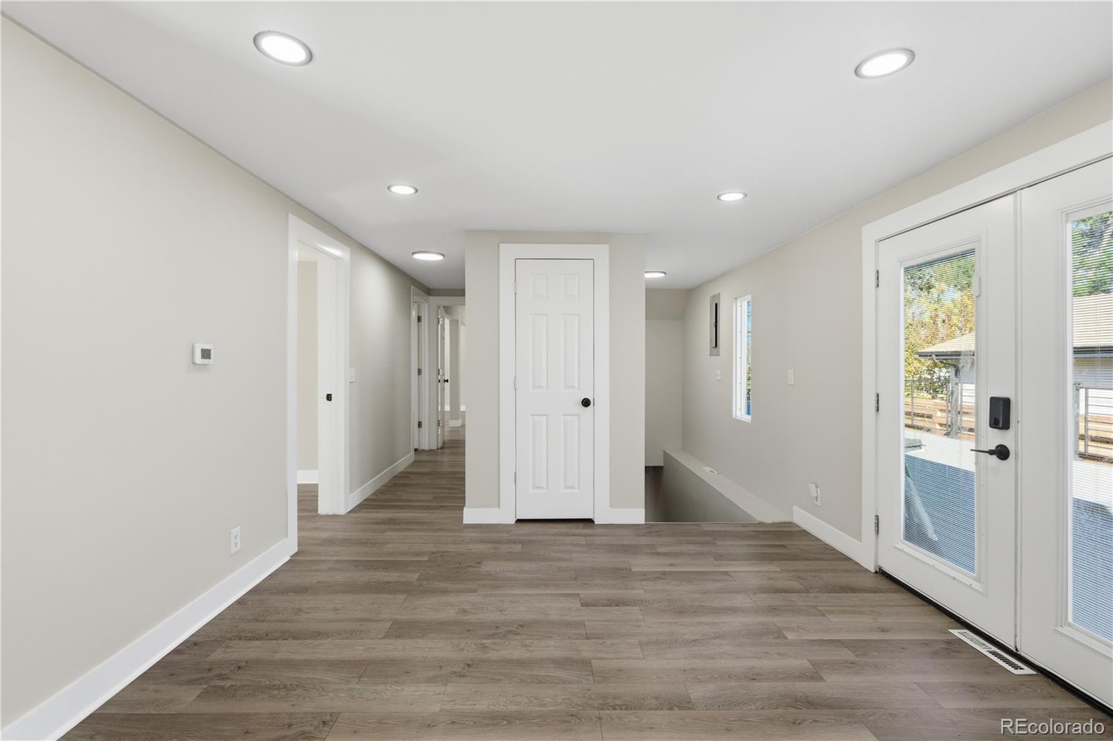 610 6th Street Bennett, CO 80102 - Photo 2 of 8 a view of a hallway with wooden floor and closet