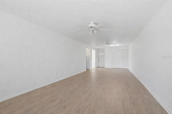 a view of an empty room with a fan