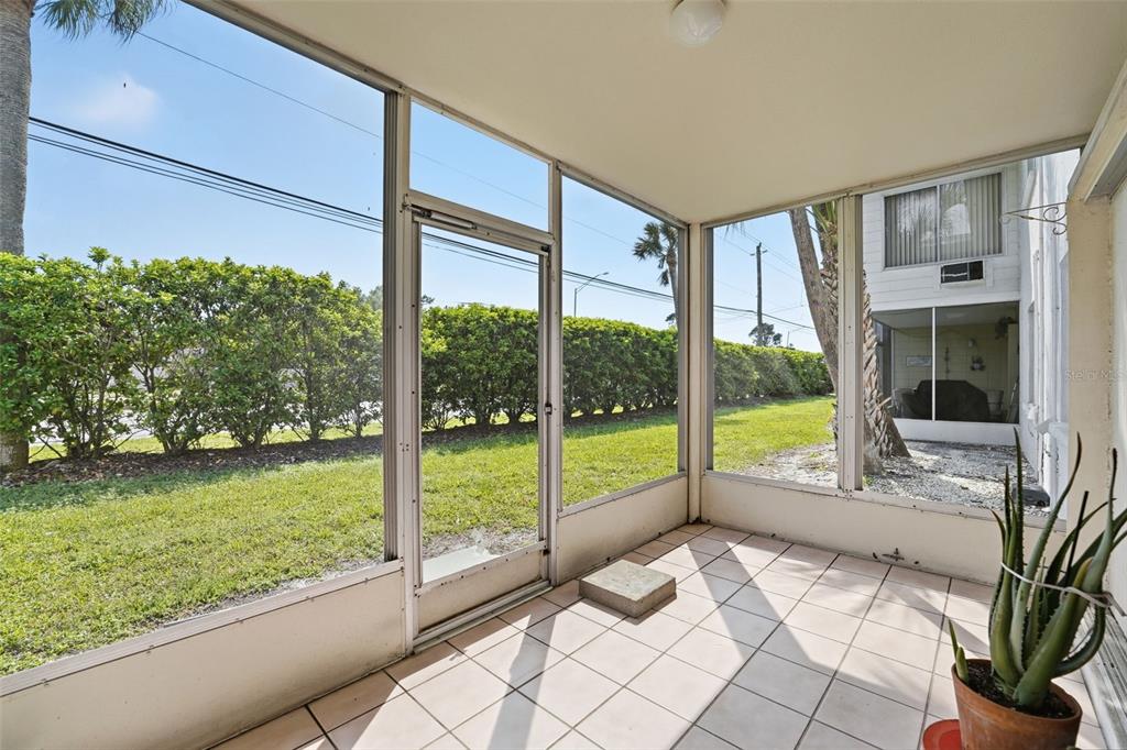 3900 Roxane Boulevard, Unit 10A Sarasota, FL 34235 - Photo 26 of 30 a view of a living room and floor to ceiling window or lake view