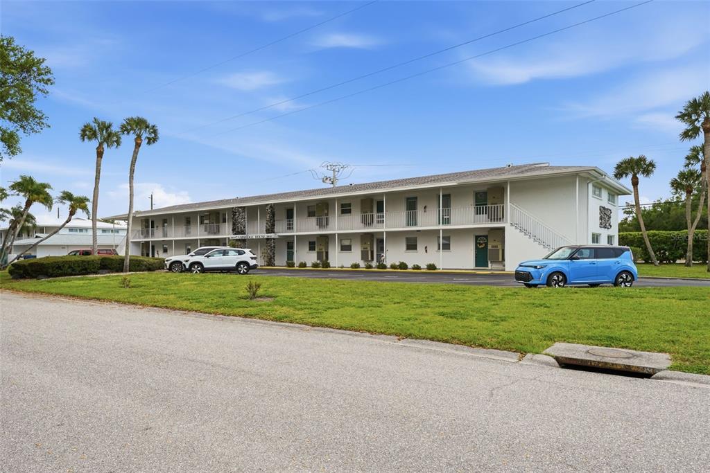 3900 Roxane Boulevard, Unit 10A Sarasota, FL 34235 - Photo 29 of 30 a view of a house with a yard and many windows