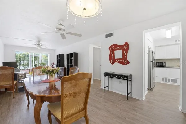 a view of a dining room with furniture window and wooden floor