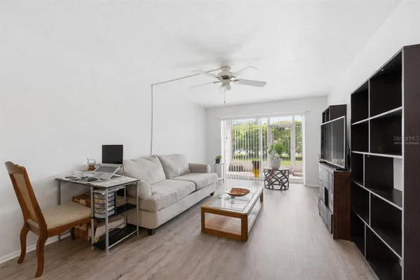 a living room with furniture and a large window