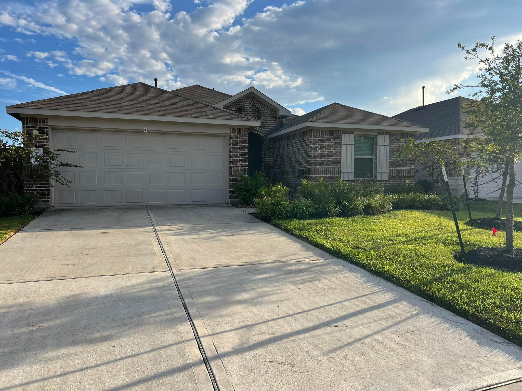 a front view of a house with garden