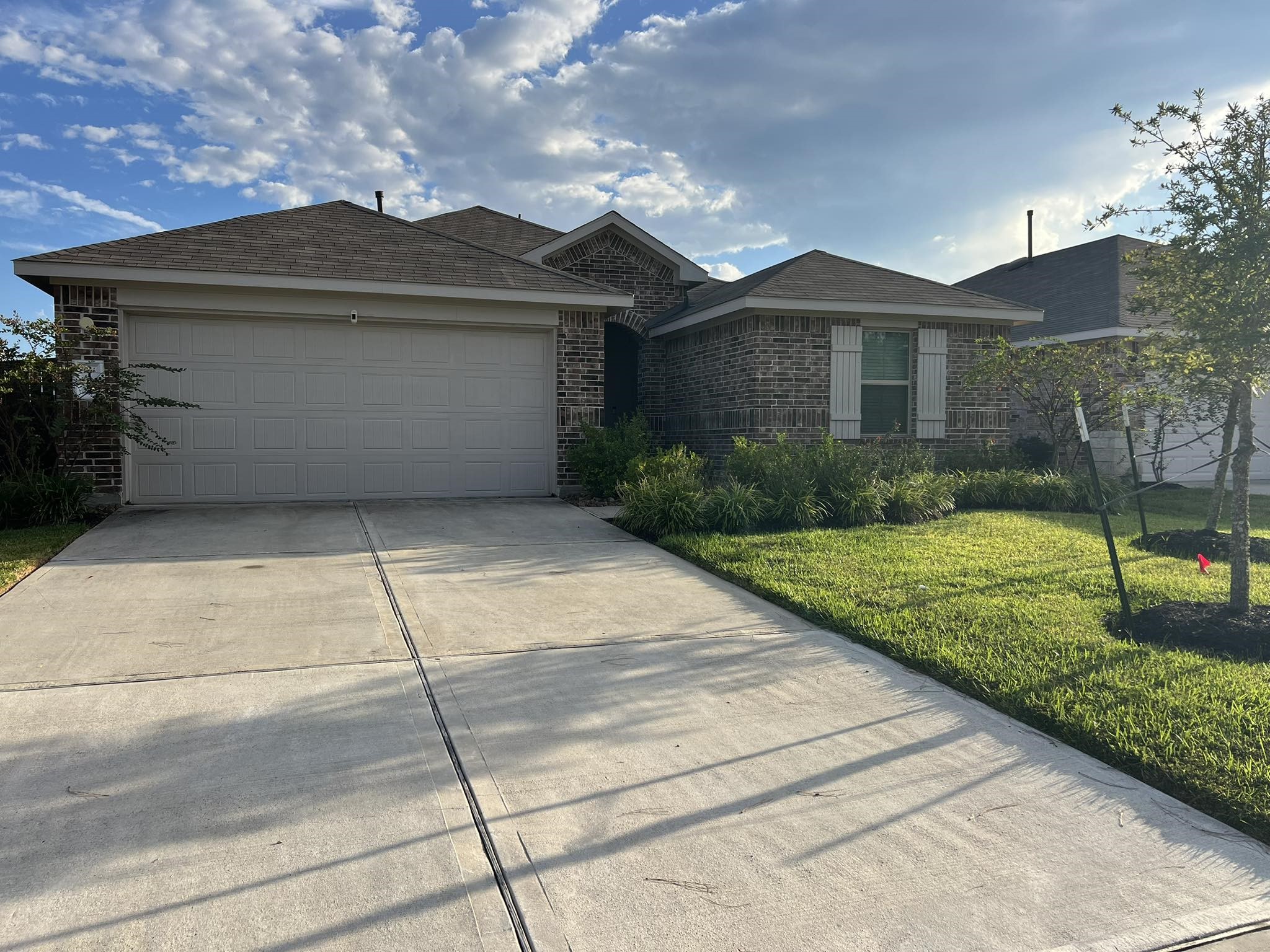 21354 Owl Road New Caney, TX 77357 - Photo 1 of 11 Discover your perfect retreat in this charming brick home with a spacious two-car garage and lush front yard. Ideal for modern living in a serene neighborhood.