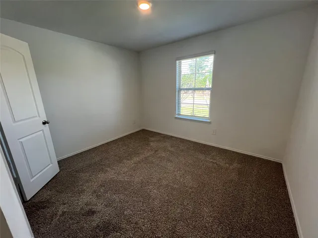 a view of house with yard and ocean view