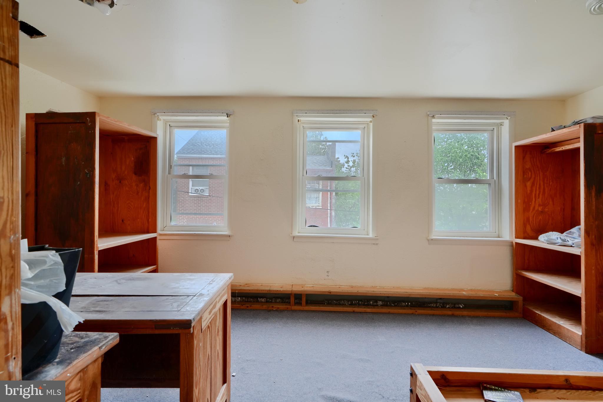116 Callender Street Baltimore, MD 21201 - Photo 21 of 47 a room with furniture and window