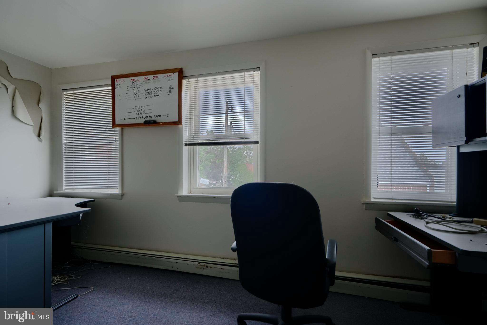 116 Callender Street Baltimore, MD 21201 - Photo 39 of 47 a view of room with window and wooden floor