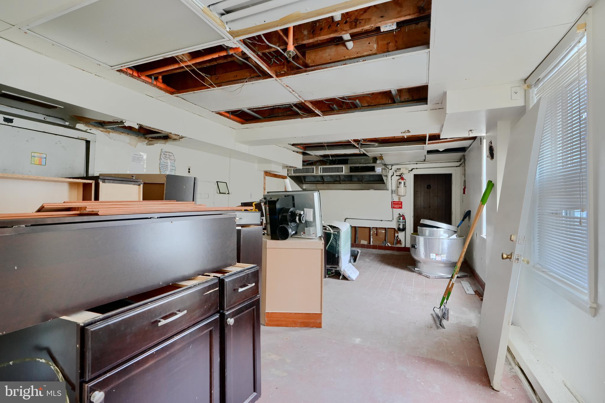 116 Callender Street Baltimore, MD 21201 - Photo 7 of 47 a view of storage and utility room with racks