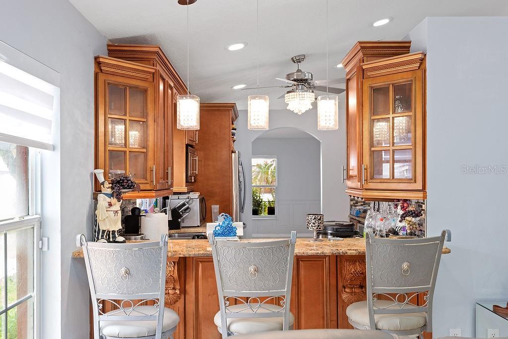 4907 Carlyle Road Tampa, FL 33615 - Photo 11 of 29 a room with a chair and dining table