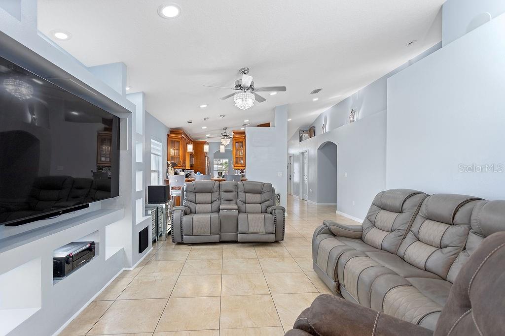 4907 Carlyle Road Tampa, FL 33615 - Photo 14 of 29 a living room with furniture and a flat screen tv
