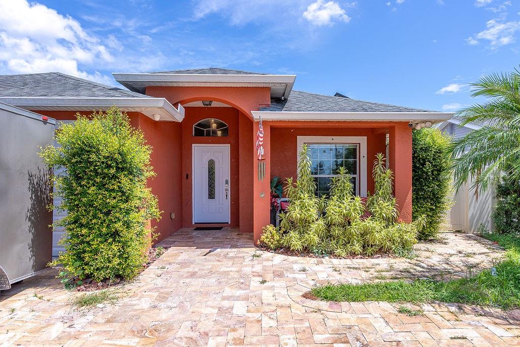 4907 Carlyle Road Tampa, FL 33615 - Photo 2 of 29 a front view of a house with garden