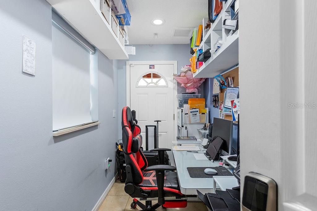 4907 Carlyle Road Tampa, FL 33615 - Photo 23 of 29 a view of a room with gym equipment