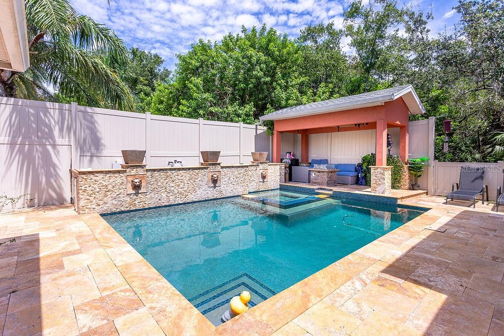 4907 Carlyle Road Tampa, FL 33615 - Photo 24 of 29 a view of a backyard with a patio and plants