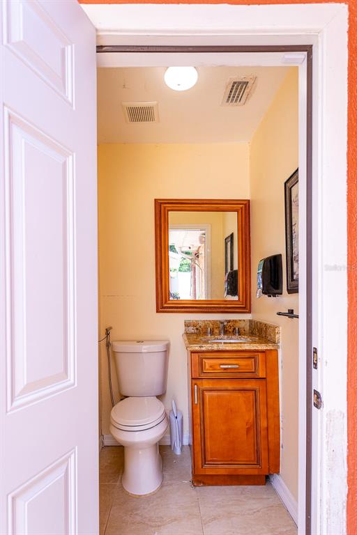 4907 Carlyle Road Tampa, FL 33615 - Photo 28 of 29 a bathroom with a toilet and a sink