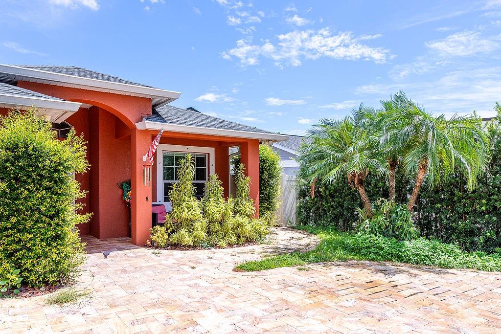 4907 Carlyle Road Tampa, FL 33615 - Photo 3 of 29 a front view of a house with garden