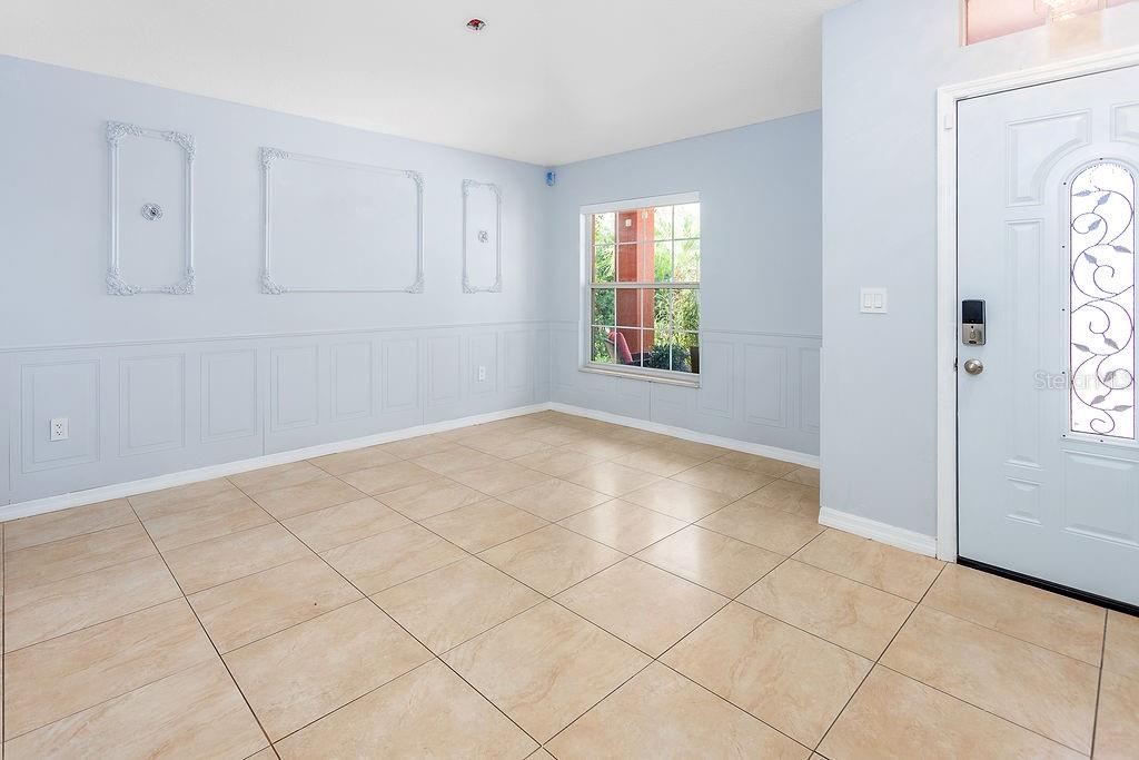 4907 Carlyle Road Tampa, FL 33615 - Photo 6 of 29 an empty room with windows