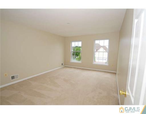 34 Lexington Road Monmouth Junction, NJ 08852 - Photo 12 of 17 a view of an empty room with a window