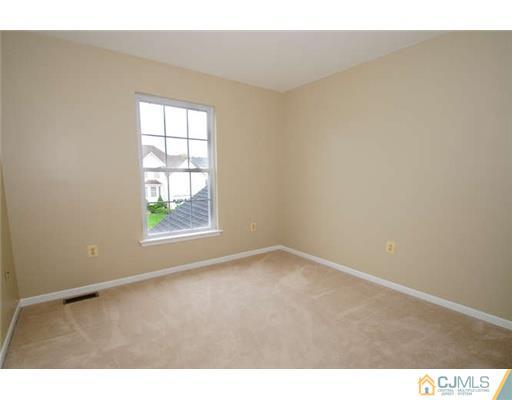 34 Lexington Road Monmouth Junction, NJ 08852 - Photo 13 of 17 an empty room with windows
