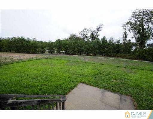 34 Lexington Road Monmouth Junction, NJ 08852 - Photo 17 of 17 a backyard of a house with lots of green space