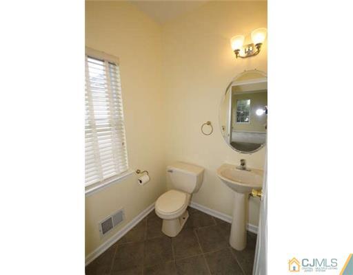 34 Lexington Road Monmouth Junction, NJ 08852 - Photo 7 of 17 a bathroom with a toilet and a sink