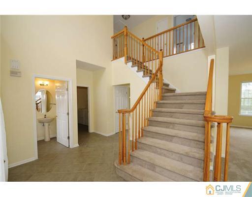 34 Lexington Road Monmouth Junction, NJ 08852 - Photo 8 of 17 a view of entryway and hall with wooden floor