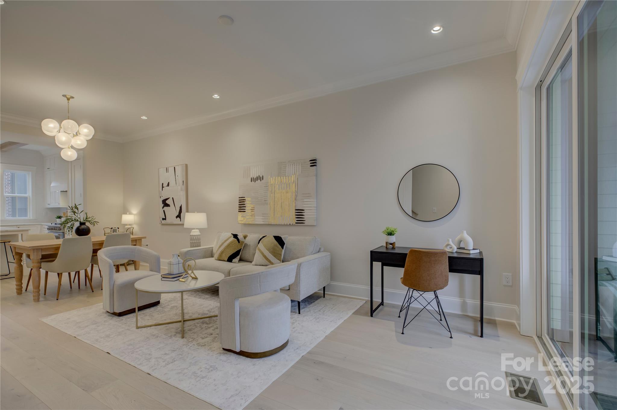 3015 Pinehurst Place Charlotte, NC 28209 - Photo 11 of 31 a living room with furniture a mirror and wooden floor