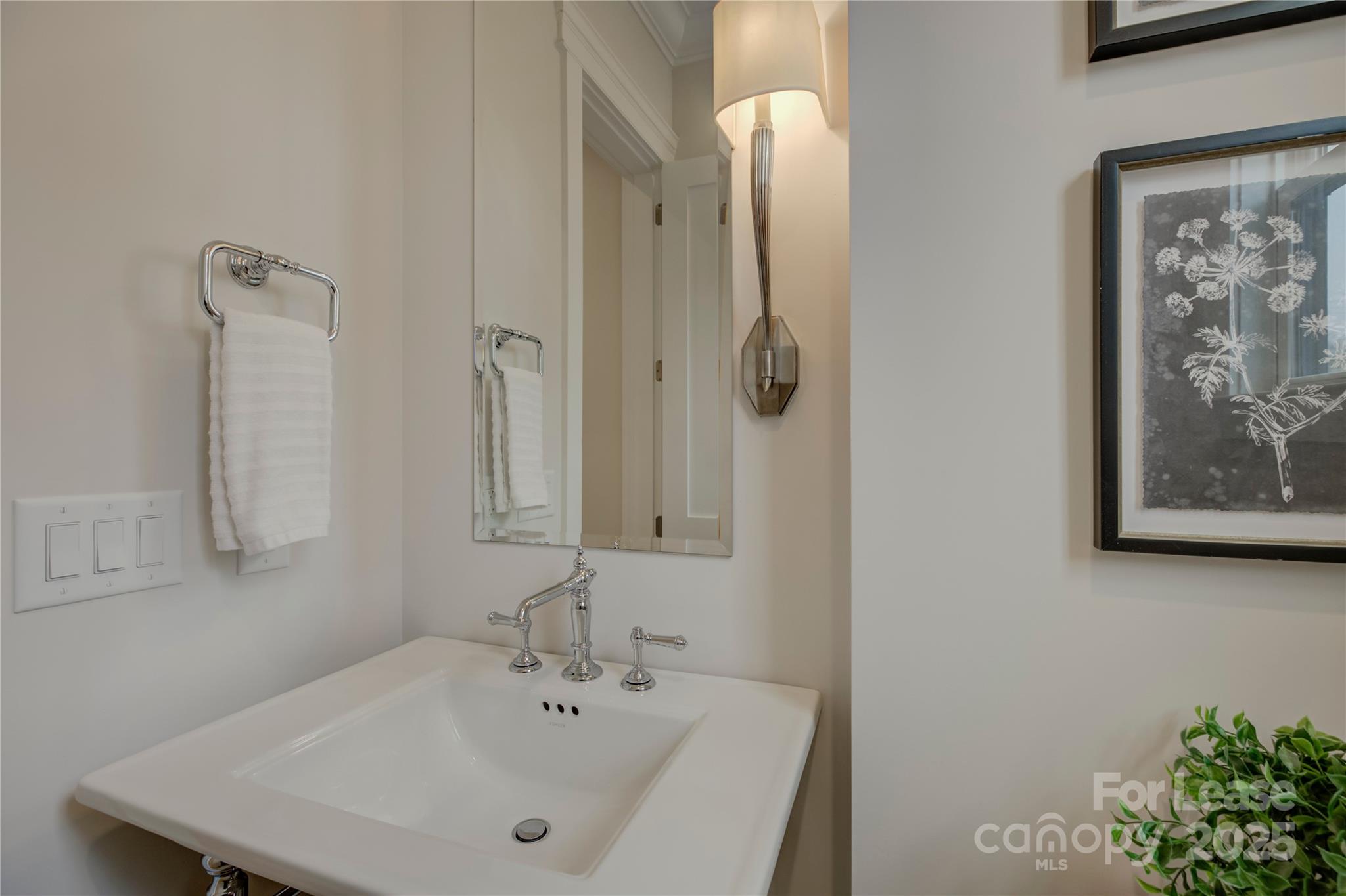 3015 Pinehurst Place Charlotte, NC 28209 - Photo 14 of 31 a bathroom with a sink and mirror