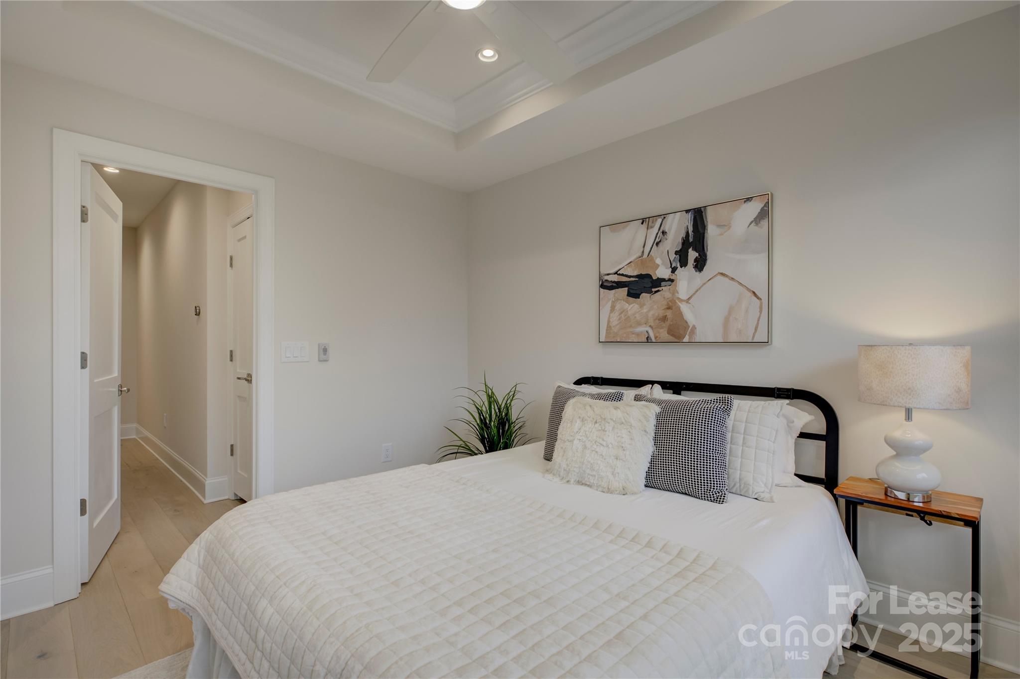 3015 Pinehurst Place Charlotte, NC 28209 - Photo 20 of 31 a bedroom with a bed and painting on the wall