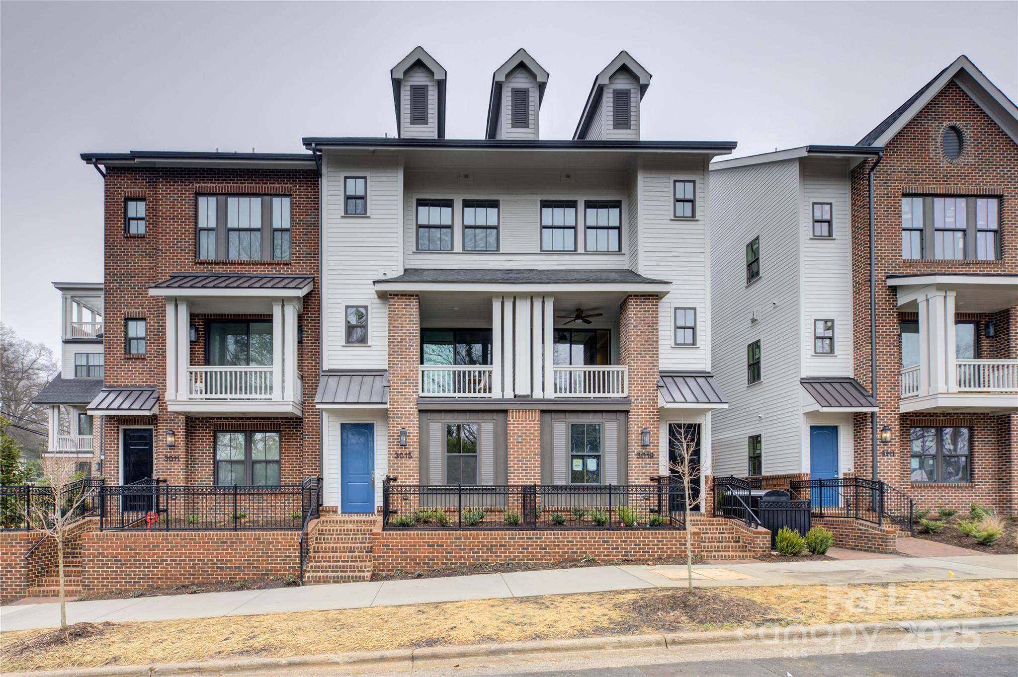 3015 Pinehurst Place Charlotte, NC 28209 - Photo 2 of 31 a front view of a building with street
