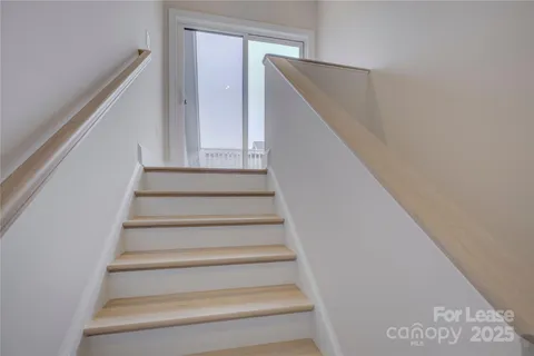 a view of a balcony with furniture