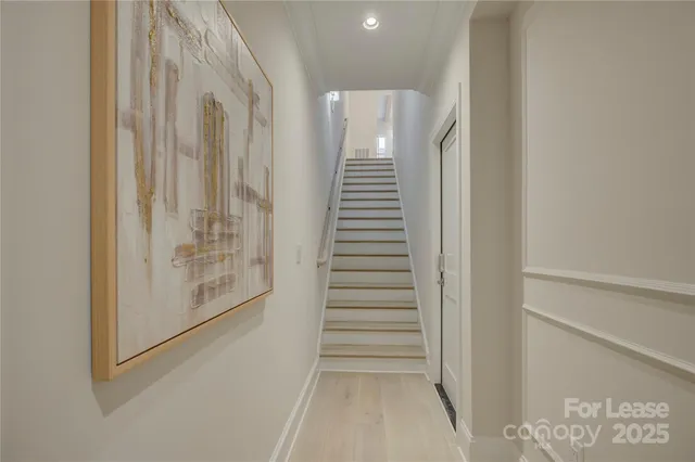 a view of entryway with stairs and wooden floor
