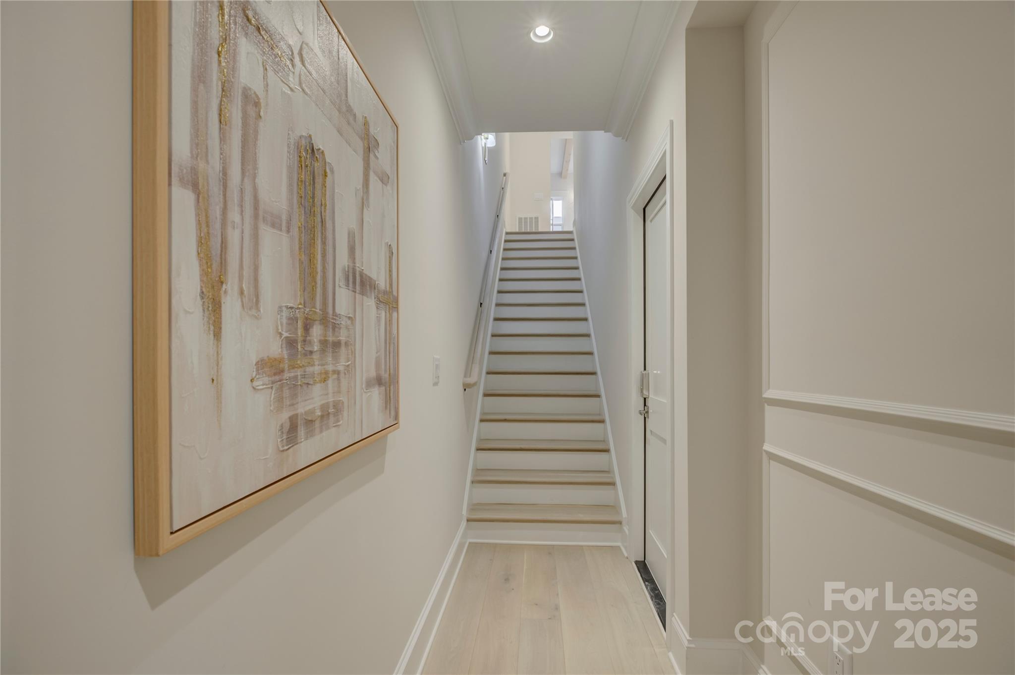 3015 Pinehurst Place Charlotte, NC 28209 - Photo 4 of 31 a view of entryway with stairs and wooden floor