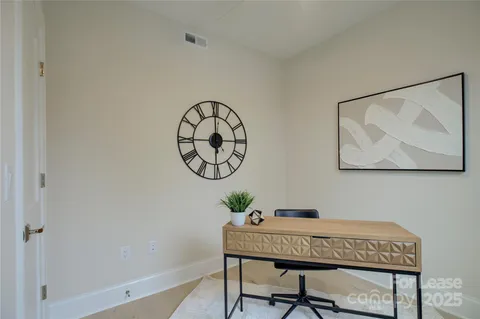 a workspace with furniture and a window