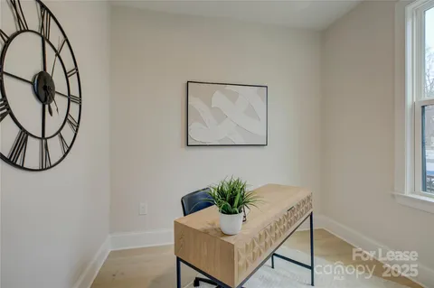 a workspace with furniture and window