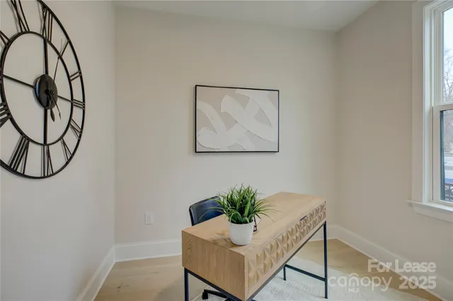 a workspace with furniture and window