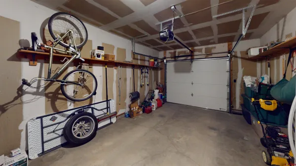 a view of garage with racks on the wall
