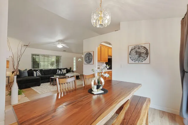 a living room with fireplace furniture and a wooden floor