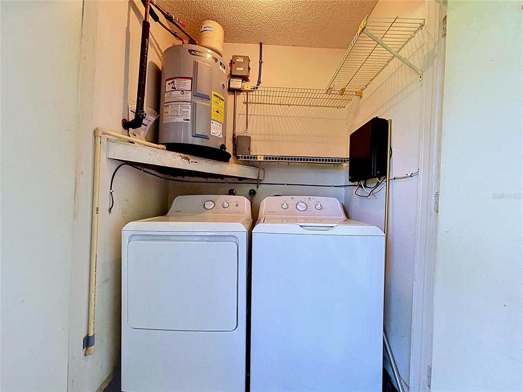 9319 Trowbridge Court New Port Richey, FL 34655 - Photo 55 of 78 a utility room with dryer and washer