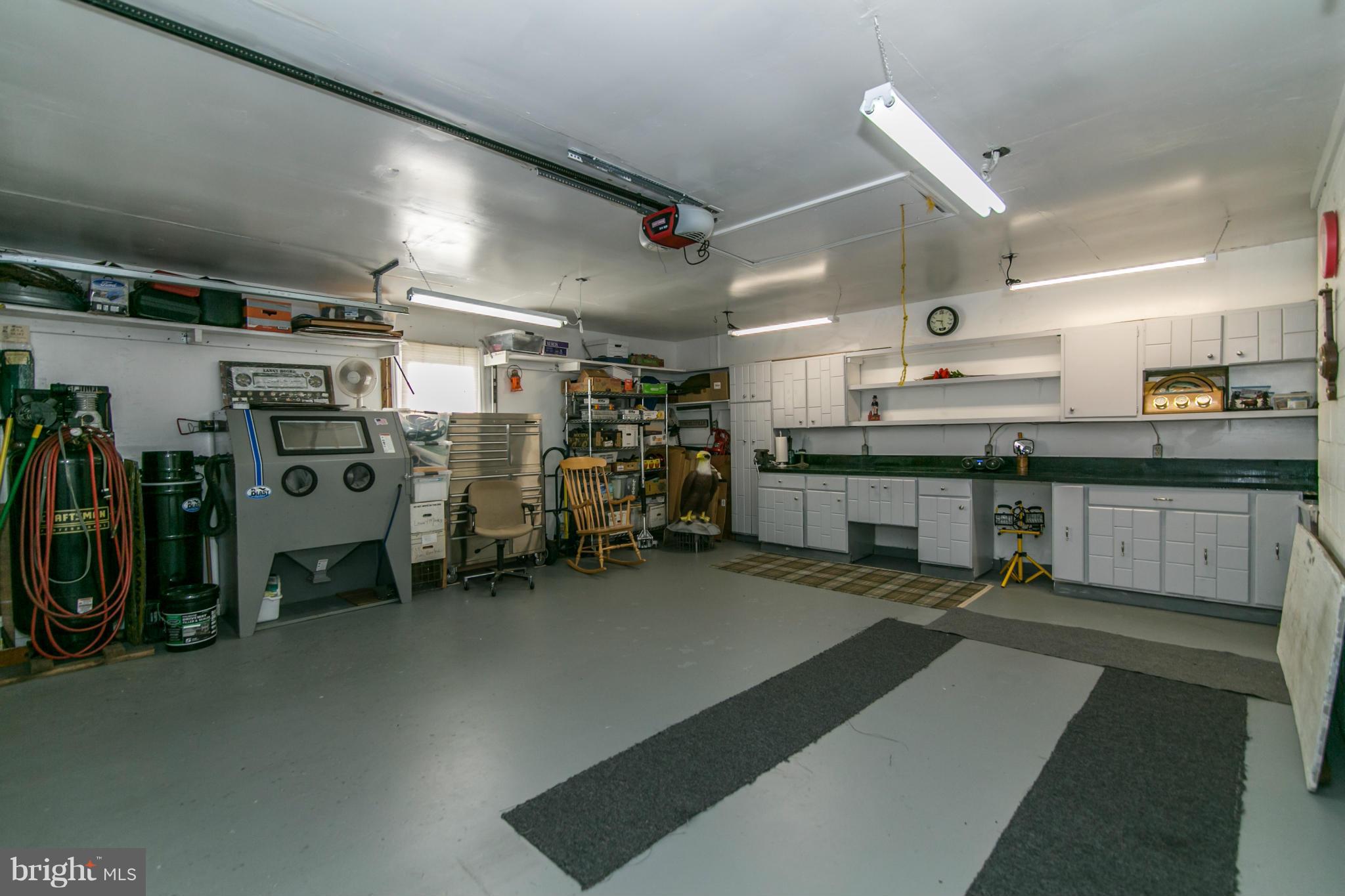 12003 Trotter Lane Reston, VA 20191 - Photo 16 of 30 The garage has great lighting and workshop space.