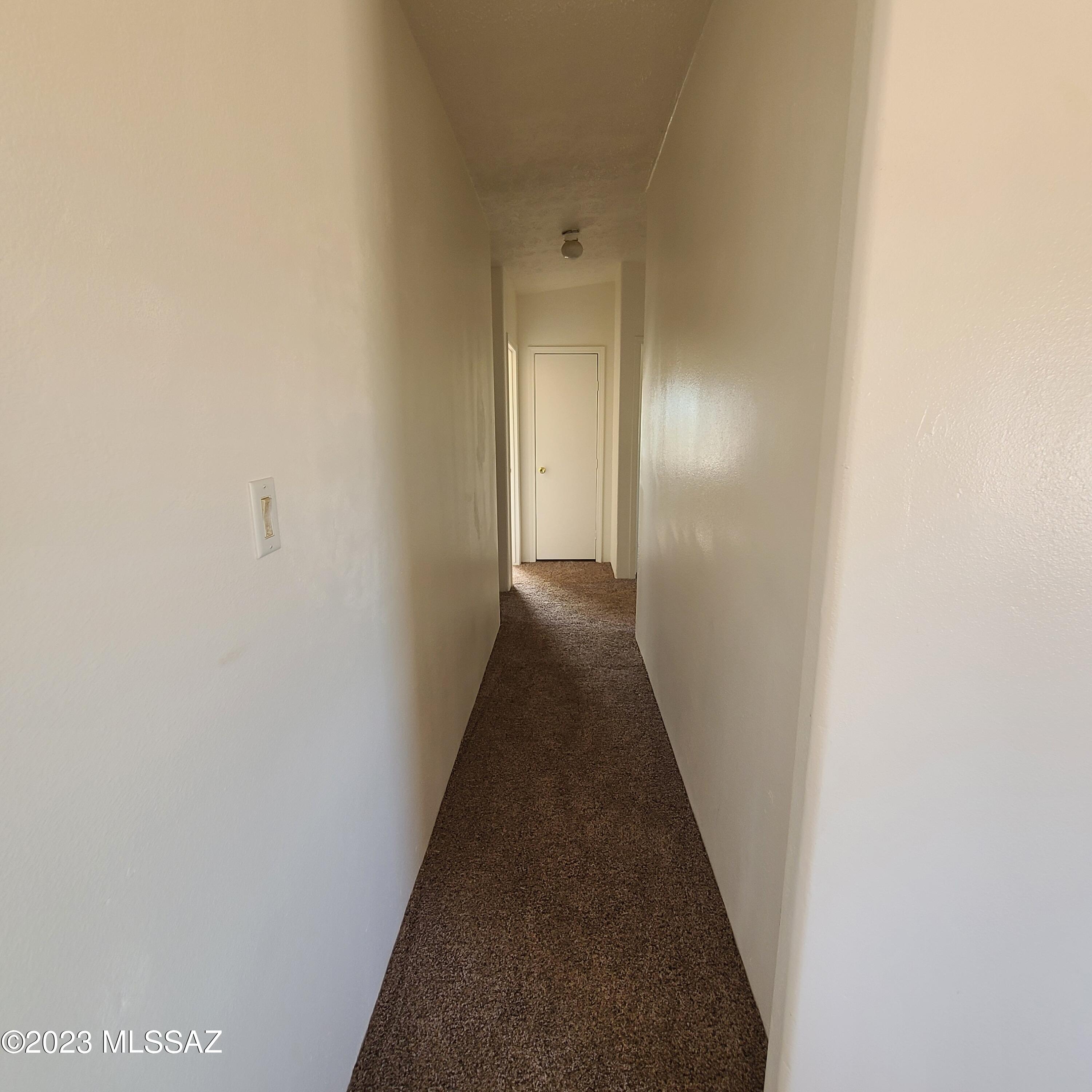 8896 South Marstellar Road Tucson, AZ 85736 - Photo 15 of 39 a view of a hallway